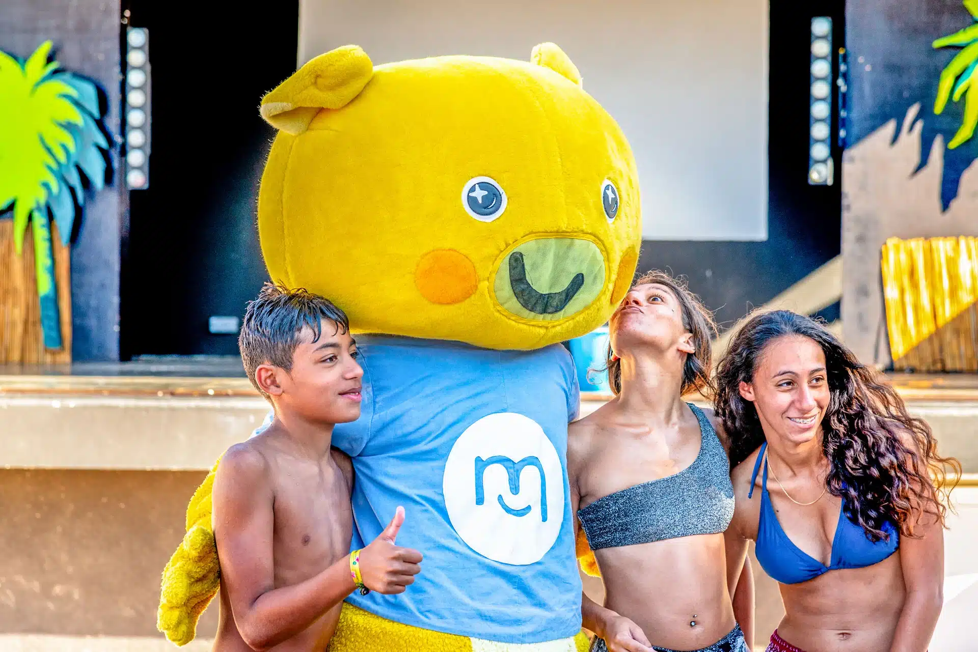 teen group and mascot